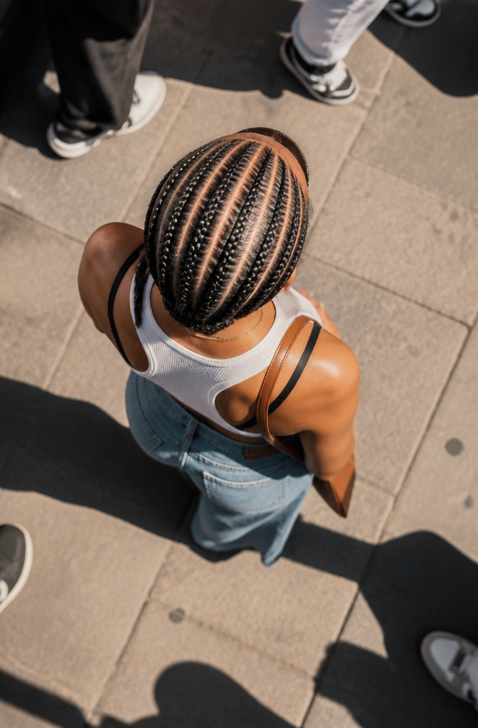 20 Pretty Hairstyles with Braids for 2026 10 Woman with neat cornrows styled in raised rows against her scalp.