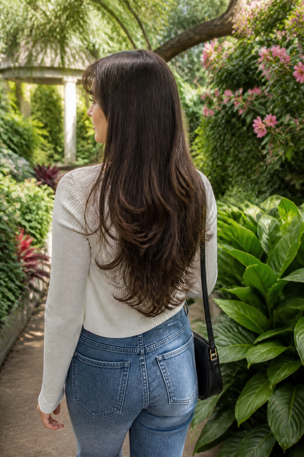 19 Trending Long Layered Hair with Bangs Styles for 2026 15 Model showcasing long brunette layers with peek-a-boo bangs.