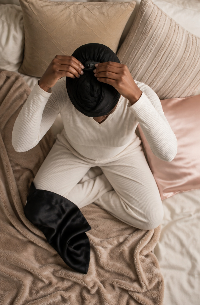 A photograph demonstrating the overnight hair wrapping technique.