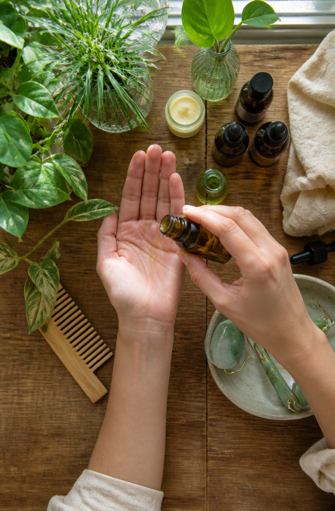 Scalp Massage for Hair Growth: Methods, Tools & Techniques 6 Bottles of essential oils placed on a surface for scalp massage.